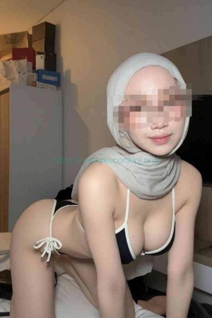 Kesya in a bikini and hijab, posing provocatively